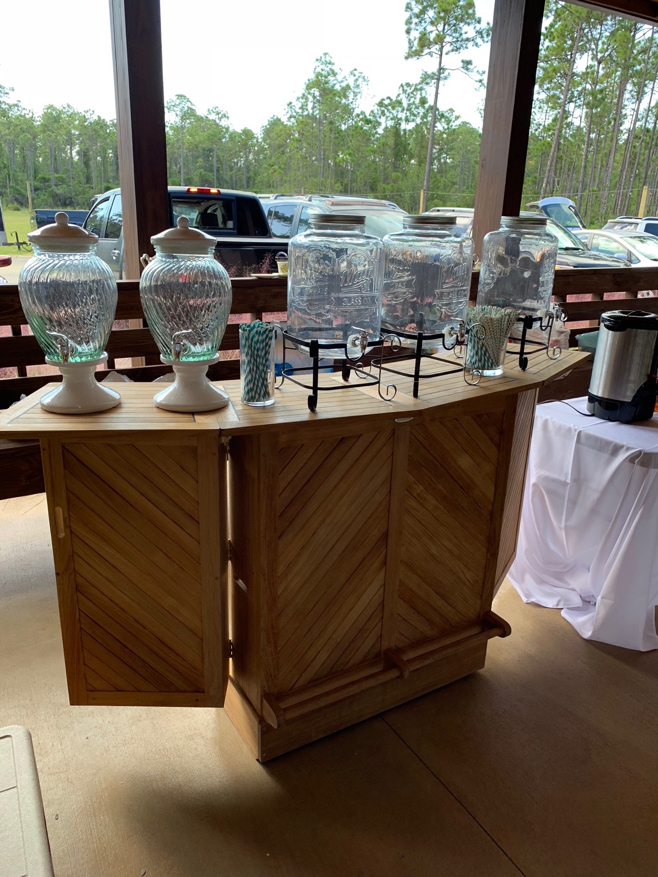 Curated hospitality setup inside the pavilion with beverage service ready for guests