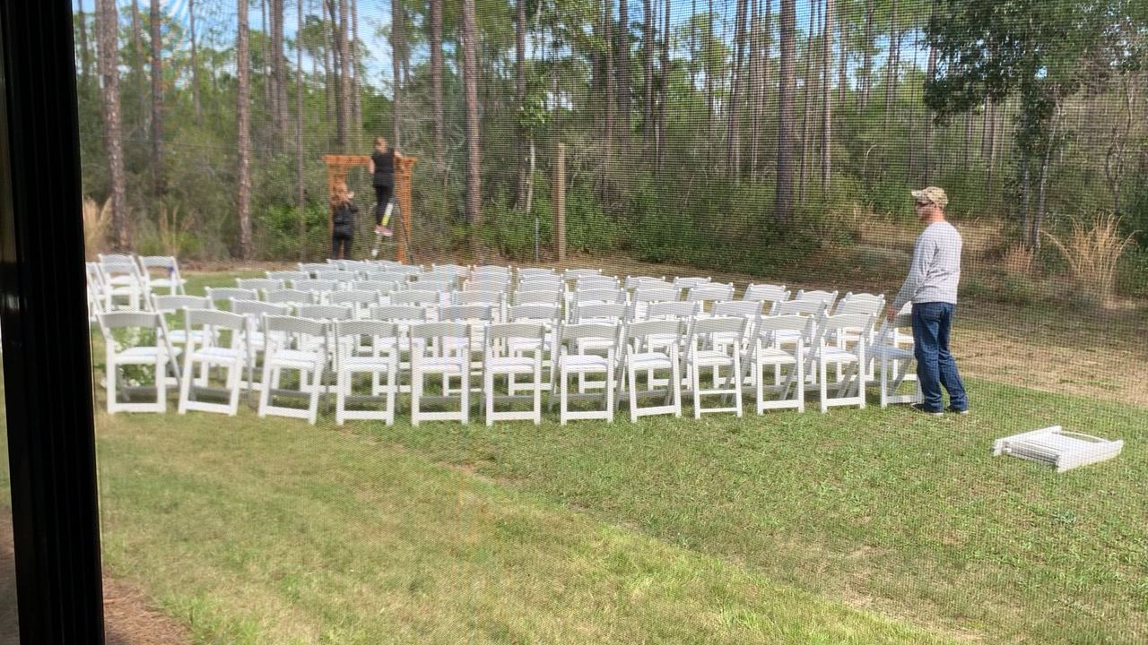 Outdoor ceremony chairs set in rows on the lawn at Point Preserve