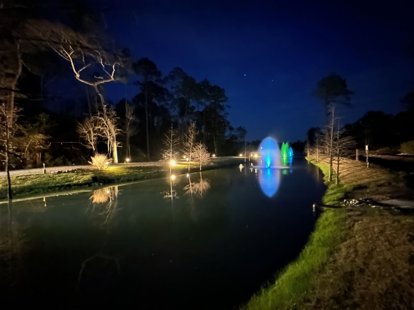 Nighttime water feature lighting at Point Preserve during an evening event